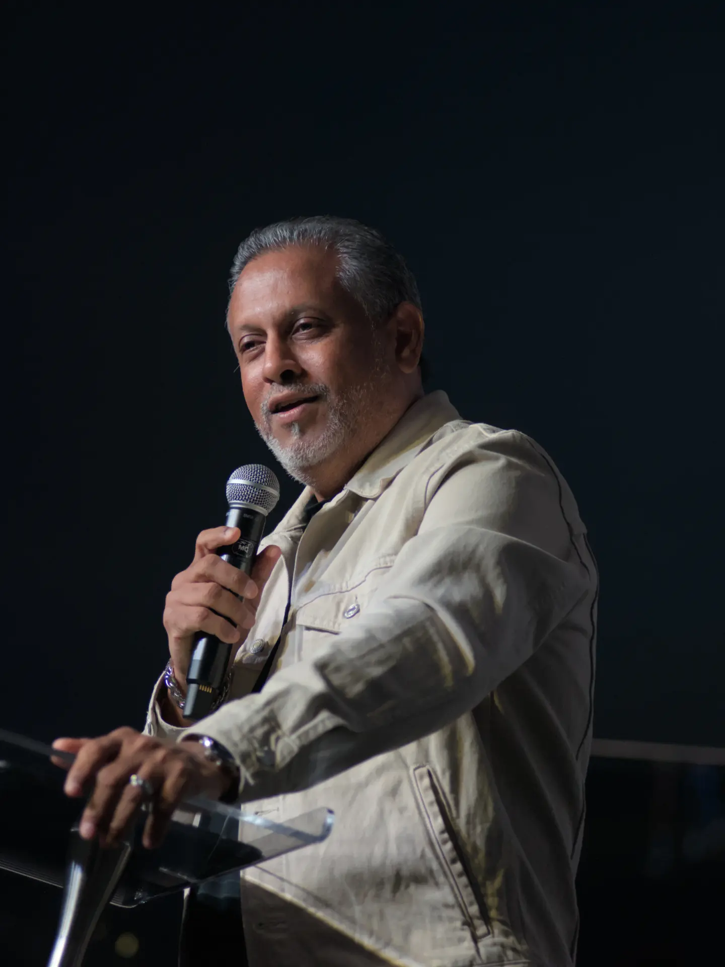 Dr. Albert Isaac speaking at a podium